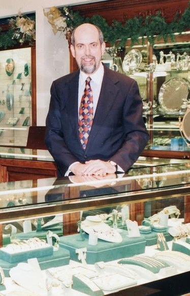 Ernie Perry behind the counter of the original store