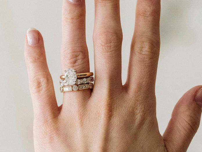 Oval diamond engagement ring with stacked bands