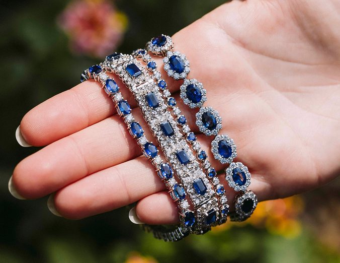 Sapphire and diamond bracelets in hand